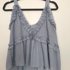 Light blue flowy top with ruffled detail- M/L